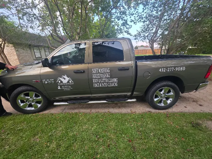 SurfaceWash Revival branded service pickup truck parked outside a residential property.